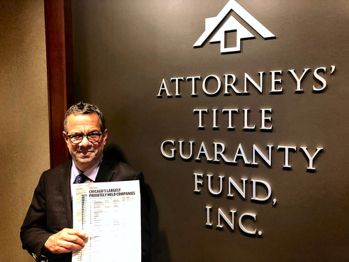 Peter Birnbaum holding issue of Crain's